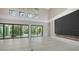Spacious living room with fireplace and sliding doors to outdoor pool area for seamless indoor-outdoor living at 1607 Flower Dr, Sarasota, FL 34239