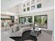 Sun-filled living room with access to outdoor dining and a gourmet kitchen at 1607 Flower Dr, Sarasota, FL 34239