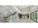 Bright home with soaring ceilings, statement staircase and an open flow to kitchen and living area at 1607 Flower Dr, Sarasota, FL 34239