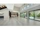 Open-concept design seamlessly connects living room, kitchen and outdoor space with a pool view at 1607 Flower Dr, Sarasota, FL 34239