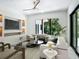 Cozy living room with plush seating, entertainment center, and a view of lush greenery at 1607 Flower Dr, Sarasota, FL 34239
