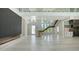 Open concept living space featuring floating staircase, modern fireplace, and abundant natural light at 1607 Flower Dr, Sarasota, FL 34239