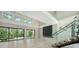 Bright living room features large sliding doors leading to the pool and a modern fireplace at 1607 Flower Dr, Sarasota, FL 34239