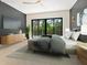 Comfortable main bedroom offers a dark accent wall and outdoor balcony access at 1607 Flower Dr, Sarasota, FL 34239