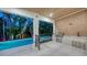Outdoor kitchen featuring a built-in grill and counter space, perfect for entertaining by the pool at 1607 Flower Dr, Sarasota, FL 34239