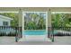 Outdoor patio with view of the pool and tropical backyard creating a serene outdoor space at 1607 Flower Dr, Sarasota, FL 34239