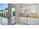 Pool cabana with a convenient kitchenette, perfect for entertaining guests by the poolside at 1607 Flower Dr, Sarasota, FL 34239