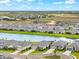 Community aerial view featuring waterfront homes, lush landscaping, and community lakes at 18317 Gulf Ranch Pl, Bradenton, FL 34211