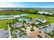 Beautiful aerial view of the community clubhouse, pool, lake and surrounding landscaping at 18317 Gulf Ranch Pl, Bradenton, FL 34211