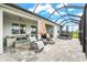 Outdoor patio with chairs, hot tub, and seating overlooking the backyard at 18317 Gulf Ranch Pl, Bradenton, FL 34211