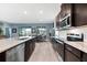 Open kitchen with stainless steel appliances and an adjacent dining area at 18317 Gulf Ranch Pl, Bradenton, FL 34211