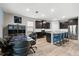 Open floor plan with kitchen island, stainless steel appliances, and adjacent dining area at 18317 Gulf Ranch Pl, Bradenton, FL 34211