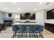 Kitchen island with seating, stainless steel appliances, and ample cabinet space at 18317 Gulf Ranch Pl, Bradenton, FL 34211