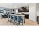 Modern kitchen island featuring stainless steel appliances and stylish seating at 18317 Gulf Ranch Pl, Bradenton, FL 34211