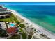 Breathtaking aerial view of pristine white sandy beach with turquoise water and beachside condos at 2045 Gulf Of Mexico Dr # M1-505, Longboat Key, FL 34228