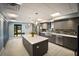 Stylish community kitchen with stainless steel appliances, island, and modern cabinetry at 2045 Gulf Of Mexico Dr # M1-505, Longboat Key, FL 34228