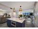 Kitchen area with center island flowing into living area with ocean view at 2045 Gulf Of Mexico Dr # M1-505, Longboat Key, FL 34228