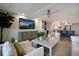 Comfortable living room that flows into a modern kitchen with center island at 2045 Gulf Of Mexico Dr # M1-505, Longboat Key, FL 34228