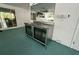 Patio stainless steel bar area with double glass door refrigerator and overhead mirror at 2159 Constitution Blvd, Sarasota, FL 34231