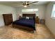 Bedroom with tile flooring, dark wood furniture and a ceiling fan at 2159 Constitution Blvd, Sarasota, FL 34231