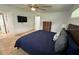 Bedroom with tile floors, dark wooden furniture, television and blue comforter at 2159 Constitution Blvd, Sarasota, FL 34231
