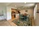 Cozy dining area with a view of the bright kitchen, featuring an accent rug, ceiling fan and natural light at 2159 Constitution Blvd, Sarasota, FL 34231
