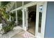 Inviting front entrance with a glass door and sidelights, showcasing the home's airy interior at 2159 Constitution Blvd, Sarasota, FL 34231