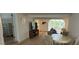 Living room with tile floors, views of dining and a decorative fish on the wall at 2159 Constitution Blvd, Sarasota, FL 34231