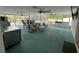 Large screened in patio with ample seating and multiple ceiling fans at 2159 Constitution Blvd, Sarasota, FL 34231