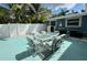 Outdoor patio with a glass table and seating for six at 2159 Constitution Blvd, Sarasota, FL 34231