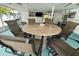 Outdoor dining area with seating for six around a large stone table at 2159 Constitution Blvd, Sarasota, FL 34231