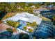 Rear exterior featuring a pool area, lush landscaping, and ample space for outdoor entertaining at 2159 Constitution Blvd, Sarasota, FL 34231