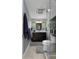 Modern bathroom featuring vanity with updated countertops, walk-in shower, and soft lighting at 22063 Lake Lindsey Rd, Brooksville, FL 34601