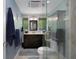 Modern bathroom featuring vanity with updated countertops, walk-in shower, and updated fixtures at 22063 Lake Lindsey Rd, Brooksville, FL 34601