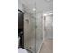 Modern bathroom featuring a tiled shower with glass door, niche, and shower head at 22063 Lake Lindsey Rd, Brooksville, FL 34601