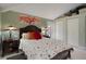 Cozy bedroom with a queen-size bed, neutral walls, and bedside tables with lamps at 22063 Lake Lindsey Rd, Brooksville, FL 34601