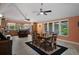 Open concept dining area adjoining the kitchen with a large table and seating for six at 22063 Lake Lindsey Rd, Brooksville, FL 34601