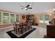 Dining room featuring a wooden table with six chairs and a ceiling fan at 22063 Lake Lindsey Rd, Brooksville, FL 34601