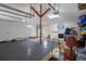 Organized garage featuring a laundry area and storage shelves at 22063 Lake Lindsey Rd, Brooksville, FL 34601