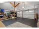 Spacious two car garage features storage shelving and an epoxy-coated floor at 22063 Lake Lindsey Rd, Brooksville, FL 34601