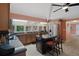 Well-lit kitchen with granite countertops, stainless steel appliances, and a center island with seating at 22063 Lake Lindsey Rd, Brooksville, FL 34601
