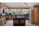 Well-equipped kitchen with a center island, stainless steel appliances, and granite countertops at 22063 Lake Lindsey Rd, Brooksville, FL 34601