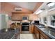 Spacious kitchen featuring granite countertops, stainless steel appliances, and ample cabinet space at 22063 Lake Lindsey Rd, Brooksville, FL 34601