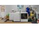 Laundry area featuring a washer, dryer, sink, and storage at 22063 Lake Lindsey Rd, Brooksville, FL 34601