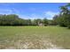 Expansive lot with mature trees, offering privacy and plenty of space for outdoor activities at 22063 Lake Lindsey Rd, Brooksville, FL 34601
