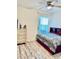 Cozy bedroom featuring wood floors, a ceiling fan, and a neutral color palette at 2410 Mizner Bay Ave, Bradenton, FL 34208