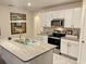 Kitchen featuring granite countertops, stainless steel appliances, and ample storage space at 2410 Mizner Bay Ave, Bradenton, FL 34208