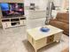Inviting living room with large screen television, neutral color palette, and comfortable furniture at 2410 Mizner Bay Ave, Bradenton, FL 34208
