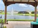 Relaxing view of community pond with water fountain from under shaded gazebo at 2410 Mizner Bay Ave, Bradenton, FL 34208