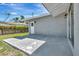 Back patio of the home offering seamless indoor-outdoor living with a door and sliding glass door at 2420 16Th W St, Palmetto, FL 34221